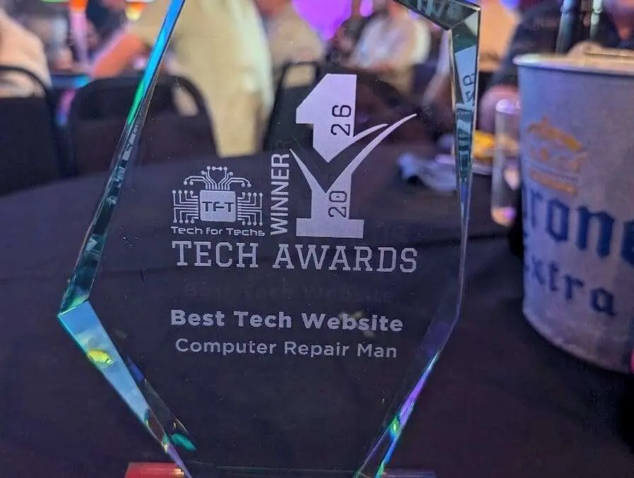 Computer Repair Man winning the 1st Place Best Tech Website trophy at the National Tech Awards 2026